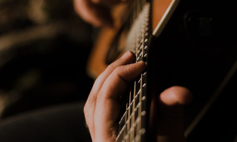 person playing guitar