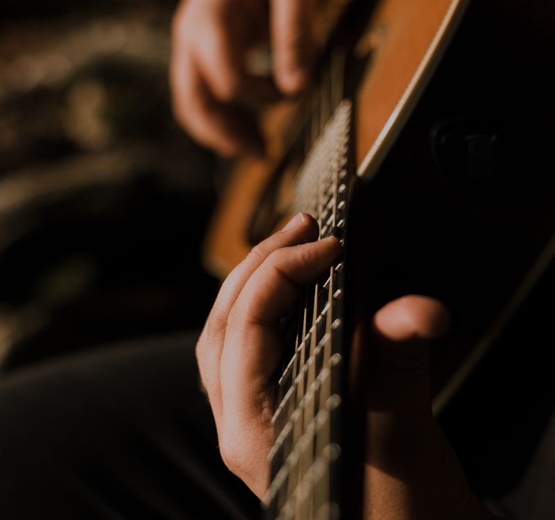 person playing guitar